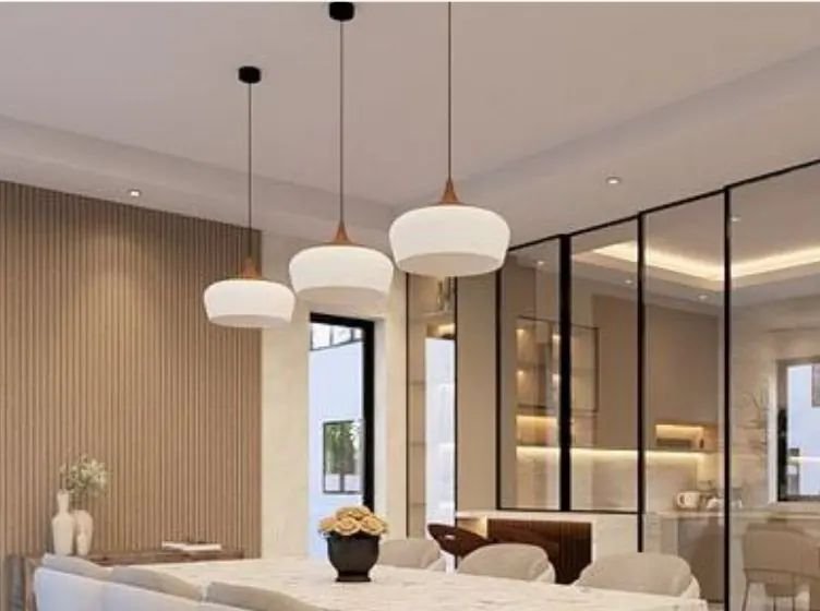 Open-plan dining area with pendant lights and glass partitions